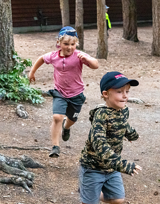 Playing Headhunters, boy chasing another boy