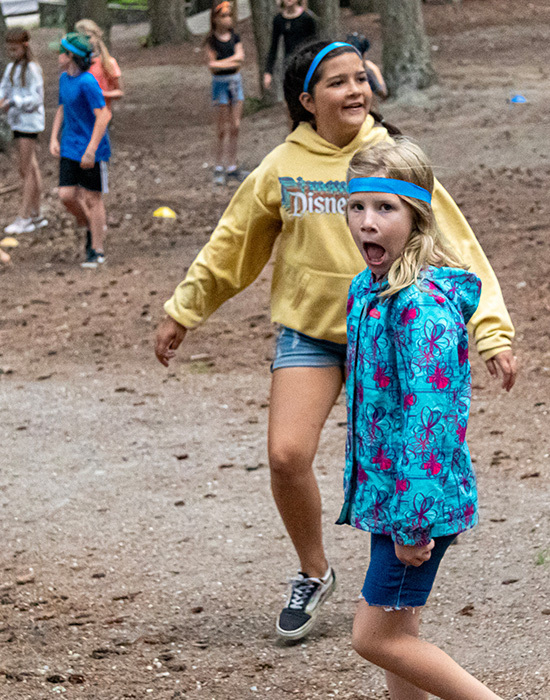 Playing Headhunters, two girls in yellow and blue